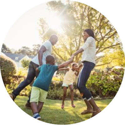 family dancing on lawn