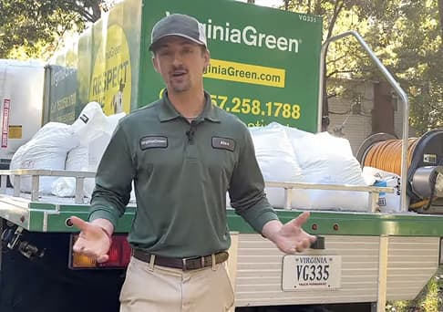 Alex Austin beside a loaded Virginia Green service truck in his Grow Beyond video